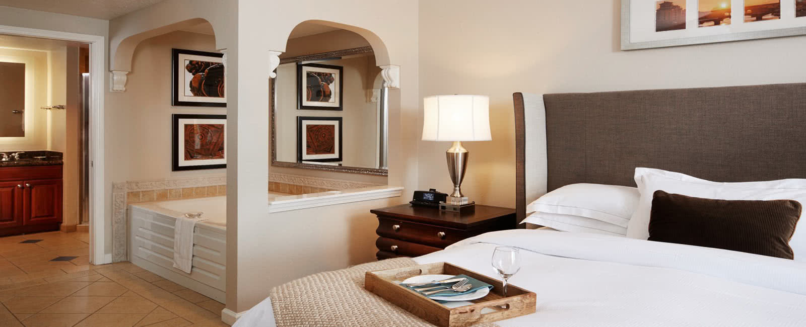 Bedroom and Tub at Hilton Grand Vacations Club at Tuscany Village in Orlando, Florida